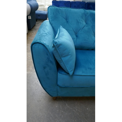 3150 - A turquoise velvet Hoxton three seater sofa