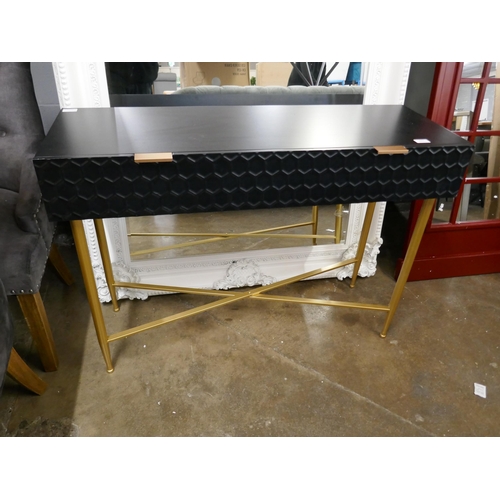 3162 - A black console table with gold legs