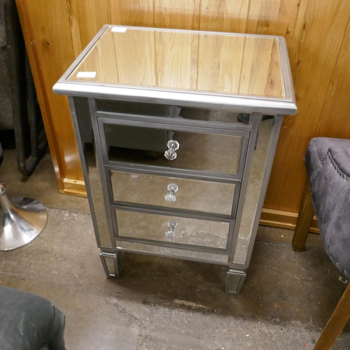 3165 - A silver mirrored three drawer chest