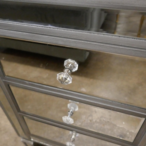 3165 - A silver mirrored three drawer chest