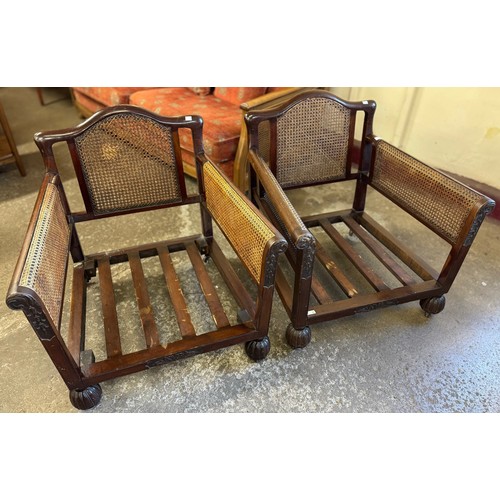 162 - A pair of early 20th century carved mahogany bergére armchairs