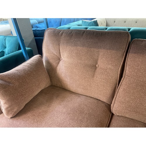 3120 - A pink upholstered two seater sofa