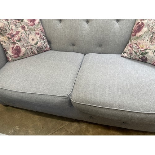 3151 - A grey upholstered Chesterfield three seater sofa bed