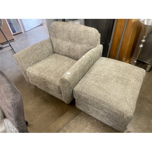 3167 - A grey weave upholstered armchair and footstool, ex display