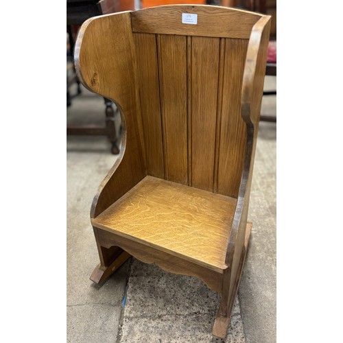 175 - A Victorian style childs oak lambing rocking chair