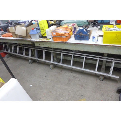 5006A - A set of double 14 rung extending metal ladders