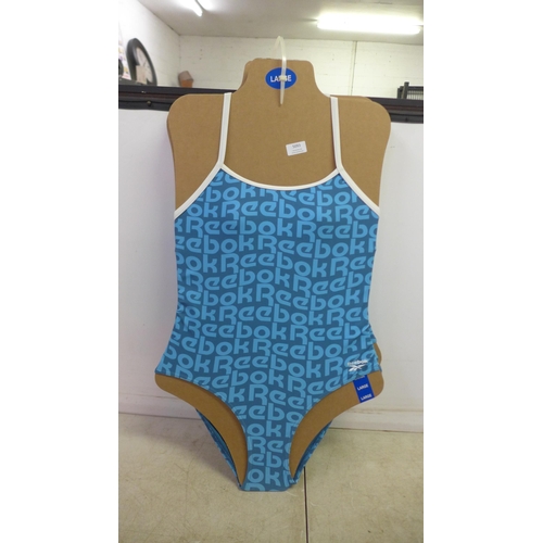 5093 - A quantity of unworn clothing including Reebok swim suits