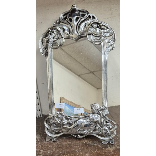 313 - An Art Nouveau style silver effect framed strut mirror