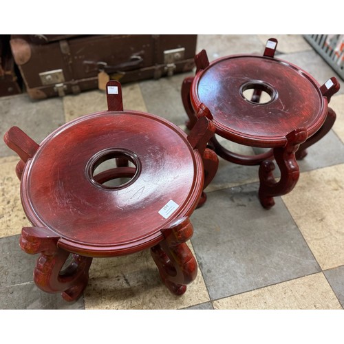 258 - A pair of Chinese carved hardwood jardiniere stands