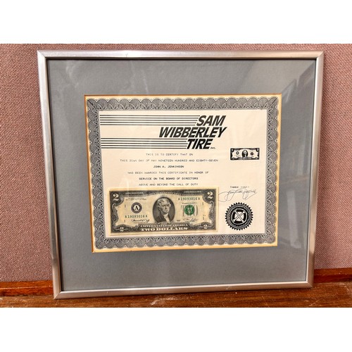 298 - A Sam Wibberley Tire Inc., two dollar bill award, framed