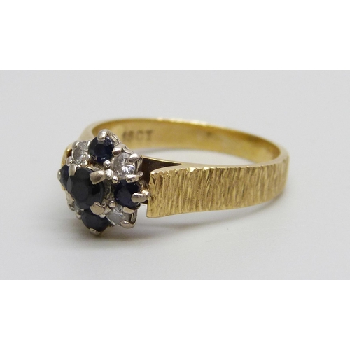 1002 - An 18ct gold 1970s style sapphire and diamond cluster ring, 4.3g, O