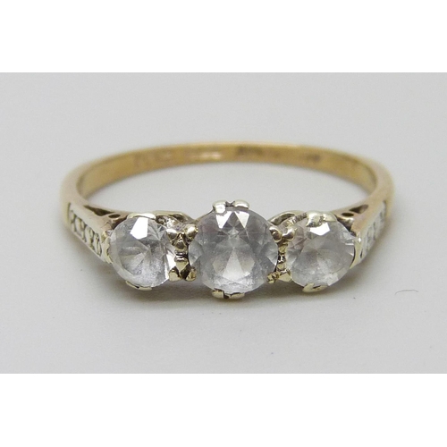 1015 - A 9ct gold, three stone synthetic white sapphire and diamond ring, 1.6g, L, shank marked 'Syn/W/Sapp... 