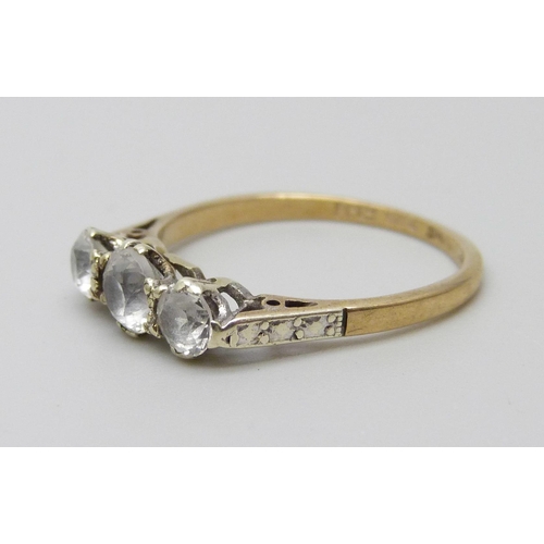 1015 - A 9ct gold, three stone synthetic white sapphire and diamond ring, 1.6g, L, shank marked 'Syn/W/Sapp... 