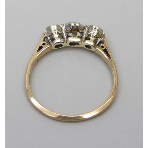 1015 - A 9ct gold, three stone synthetic white sapphire and diamond ring, 1.6g, L, shank marked 'Syn/W/Sapp... 