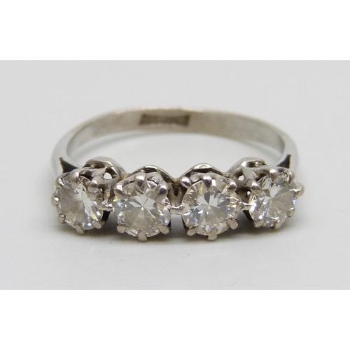 1022 - A white metal set four stone diamond ring, 2.5g, L