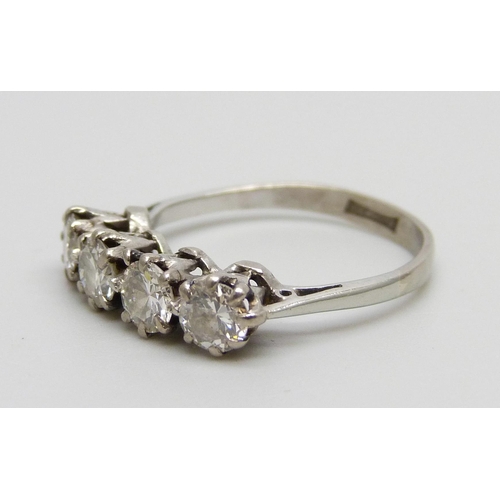 1022 - A white metal set four stone diamond ring, 2.5g, L