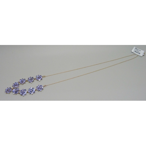 1032 - A 9ct gold and tanzanite necklace, 6.9g