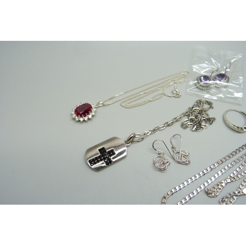 1034 - Three silver chains, two silver pendants, two pairs of silver earrings and a silver ring