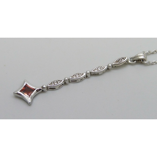 1047 - A white metal and diamond set pendant on an 18ct white gold chain, chain 2.3g and 40cm, total weight... 