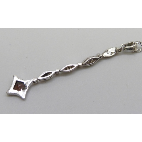 1047 - A white metal and diamond set pendant on an 18ct white gold chain, chain 2.3g and 40cm, total weight... 