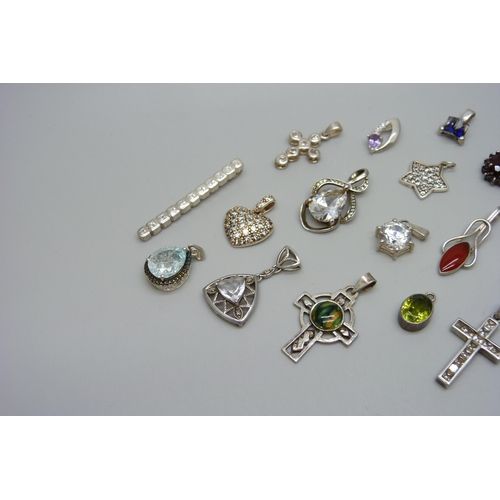 1052 - A collection of gem set silver pendants