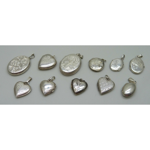 1057 - Nine silver lockets and two silver back and front lockets, (11)