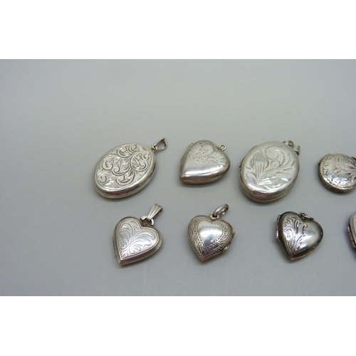 1057 - Nine silver lockets and two silver back and front lockets, (11)