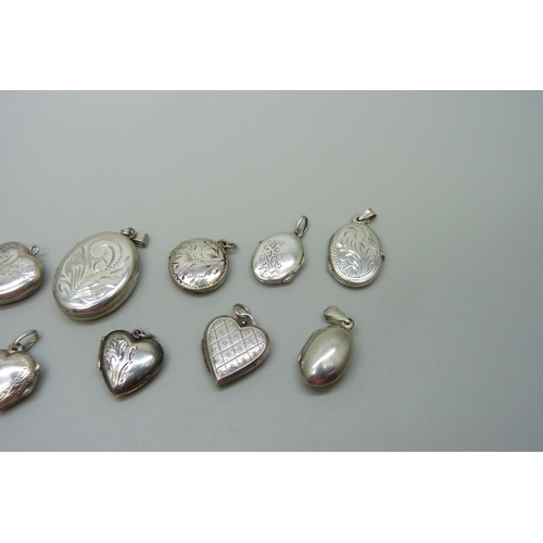 1057 - Nine silver lockets and two silver back and front lockets, (11)