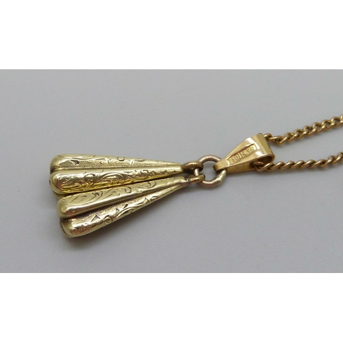 1058 - A pendant marked 750 on a 9ct gold chain, 6.3g total weight, (chain 4.3g and 46cm)