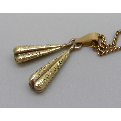 1058 - A pendant marked 750 on a 9ct gold chain, 6.3g total weight, (chain 4.3g and 46cm)