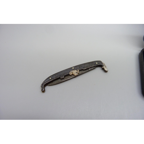 1066 - A novelty Venezia pocket knife in the form of a gondola and a silver Surrey Football fob medal, hall... 