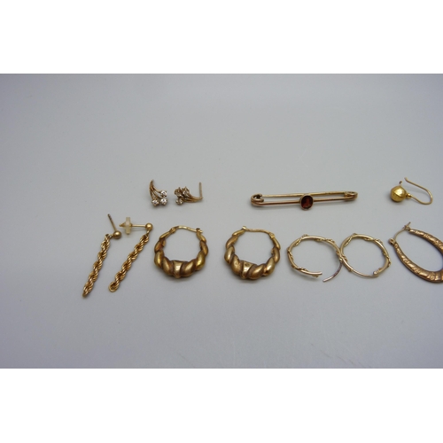 1073 - A 9ct gold brooch and two pairs of 9ct gold earrings, 4.7g, five pairs of yellow metal earrings and ... 