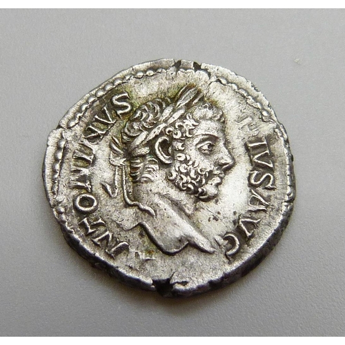 1085 - A coin; Roman silver Denarius-Caracalla 198-217, laureate bearded head of Caracalla, reverse concord... 