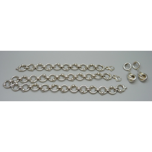 1097 - A matching silver bracelet and necklace and a pair of silver earrings, 90g