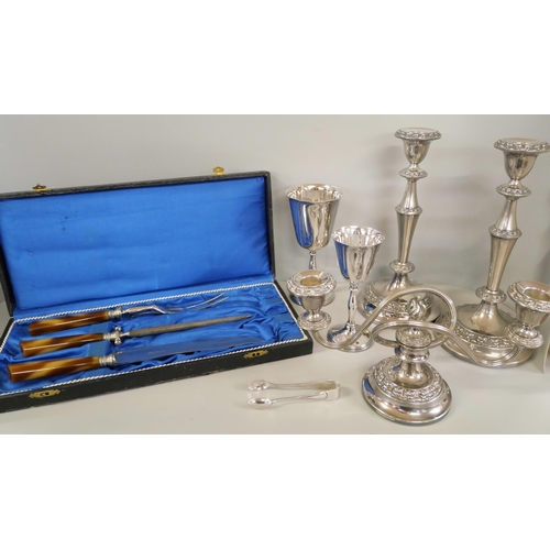 1132 - A collection of silver plated items including a pair of candlesticks, a candelabra, sugar tongs and ... 