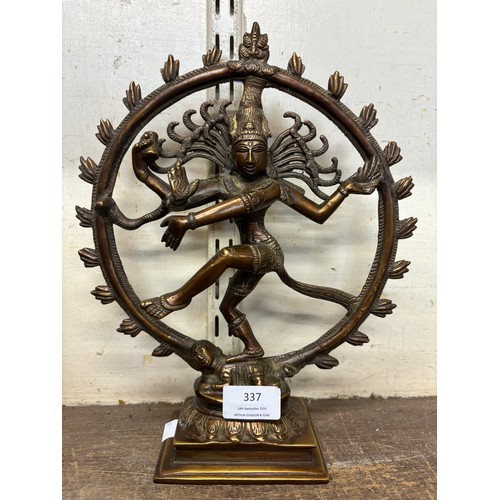 337 - An oriental bronze figure of a dancing Shiva