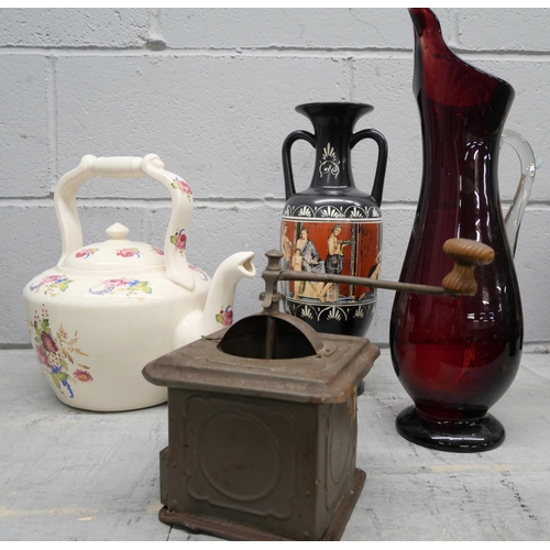 1139 - An oversized teapot, a red glass vase, an Italian two handled vase and a coffee grinder marked Golde... 