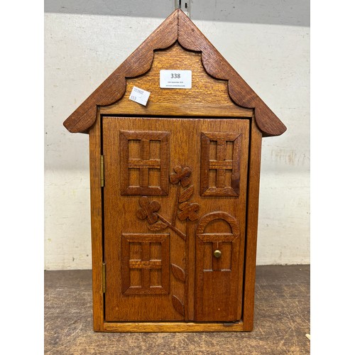 338 - An oak house shaped smokers cabinet