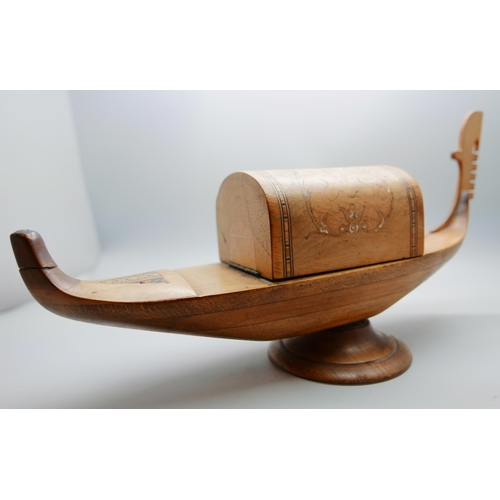 625 - A wooden cigarette dispenser, marquetry inlay, musical, in the form of a boat