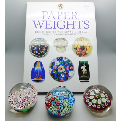 648 - Three Millefiori paperweights and a collectors book