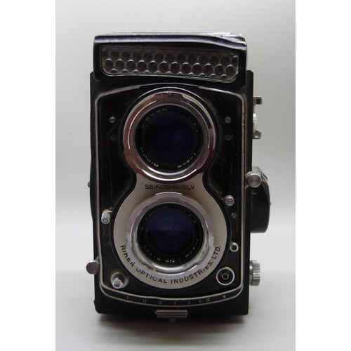 654 - A Seikosha SLV TLR camera with Ricoh and Rikenon lenses