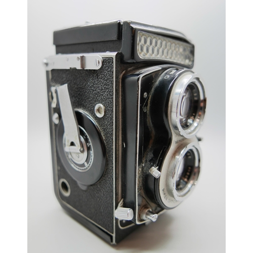 654 - A Seikosha SLV TLR camera with Ricoh and Rikenon lenses