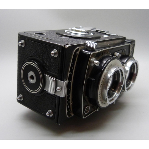 654 - A Seikosha SLV TLR camera with Ricoh and Rikenon lenses