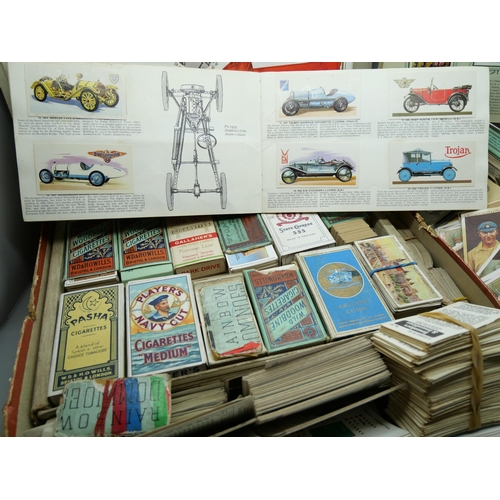 661 - A box of cigarette cards and some tea cards