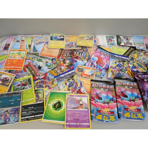 668 - A box of Pokémon cards, English, Japanese, Chinese and base cards