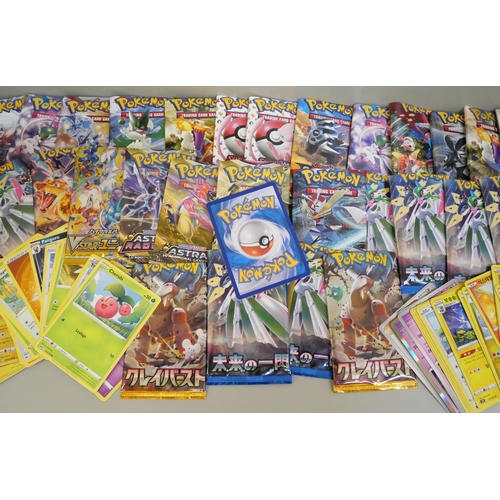 673 - A box of Pokémon cards, English, Japanese, Chinese and base cards