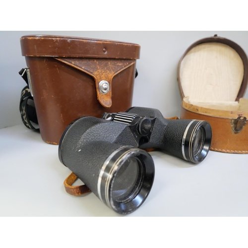 686 - A pair of Swift 8.5 x 44 extra wide field binoculars in a leather case, two belts with metal buckles... 