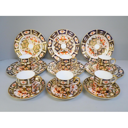 703 - A Royal Crown Derby 2451 pattern six setting coffee set; six cans, saucers and tea plates