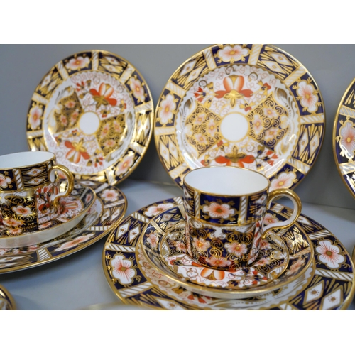 703 - A Royal Crown Derby 2451 pattern six setting coffee set; six cans, saucers and tea plates