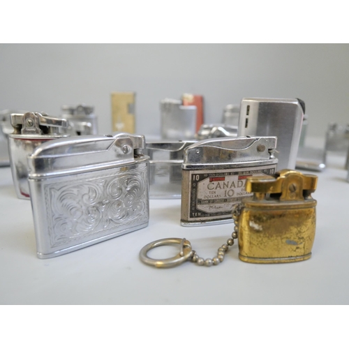 706 - Over 30 lighters including three cigarette case/lighter combinations